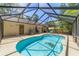 A beautiful pool in a screened-in enclosure, is a great place to relax at 6150 Nw 59Th Ave, Ocala, FL 34482