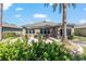Outdoor patio with lush landscaping, perfect for outdoor dining and gatherings at 7167 Sw 99Th Cir, Ocala, FL 34481