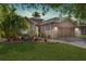 Beautiful home with a two-car garage, stone accents, mature landscaping, and a well-maintained lawn at 7167 Sw 99Th Cir, Ocala, FL 34481