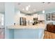 Open kitchen area featuring granite countertops, stainless steel appliances, and white cabinets at 7167 Sw 99Th Cir, Ocala, FL 34481