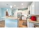 Updated kitchen features stainless appliances, granite counters, pendant lighting and wood floors at 7167 Sw 99Th Cir, Ocala, FL 34481
