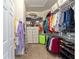 Spacious walk-in closet with built in shelving and ample room for organization and storage at 7167 Sw 99Th Cir, Ocala, FL 34481