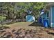Fenced backyard features a shed and mature trees at 731 Cloverleaf Blvd, Deltona, FL 32725