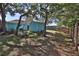 Nice backyard with a blue shed, a fence, mature trees and plenty of shade at 731 Cloverleaf Blvd, Deltona, FL 32725