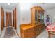 Hallway features tile floors, wood accents, and a classic wooden china cabinet in a well-lit space at 731 Cloverleaf Blvd, Deltona, FL 32725