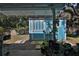 Backyard shed with a covered area, landscaping and small rock area at 731 Cloverleaf Blvd, Deltona, FL 32725