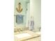 Bathroom featuring granite countertop, a large mirror and coastal decor at 7407 Sw 202 Ct, Dunnellon, FL 34431