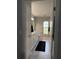 Bright bathroom with tiled floors, large vanity, and neutral color scheme, creating a serene space at 7407 Sw 202 Ct, Dunnellon, FL 34431