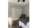 Bedroom featuring a ceiling fan, wood floors, and a closet with bi-fold doors at 7407 Sw 202 Ct, Dunnellon, FL 34431