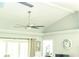 Bright room with vaulted ceilings and a modern ceiling fan at 7407 Sw 202 Ct, Dunnellon, FL 34431