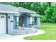 Charming single-story home with rock landscaping and walkway lighting at 7407 Sw 202 Ct, Dunnellon, FL 34431