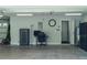 Well-organized garage featuring a work station, storage and convenient access to the home's interior at 7407 Sw 202 Ct, Dunnellon, FL 34431
