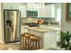 Open kitchen with granite countertops, stainless steel appliances, and an island with seating at 7407 Sw 202 Ct, Dunnellon, FL 34431