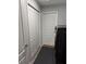 Bright laundry room with appliances, closet, and door leading to outside at 7407 Sw 202 Ct, Dunnellon, FL 34431