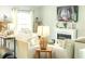 Bright living room with a fireplace, neutral tones, and comfortable seating at 7407 Sw 202 Ct, Dunnellon, FL 34431