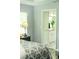 Main bedroom with wood floors leads to the main bathroom at 7407 Sw 202 Ct, Dunnellon, FL 34431