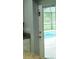 View from the kitchen onto a screened-in pool in the backyard at 7407 Sw 202 Ct, Dunnellon, FL 34431