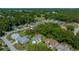 Aerial view of a beautiful home nestled among lush trees in a tranquil neighborhood at 7692 Sw 117Th Street Rd, Ocala, FL 34476