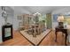 Elegant dining room with a chandelier, hardwood floors, and a decorative hutch at 7692 Sw 117Th Street Rd, Ocala, FL 34476