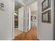 Open hallway provides clear sightlines into the bathroom and bedroom, enhancing the suite's connected and airy feel at 7692 Sw 117Th Street Rd, Ocala, FL 34476