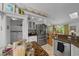 Well-equipped kitchen with stainless steel appliances, granite countertops, and a view to dining room at 7692 Sw 117Th Street Rd, Ocala, FL 34476