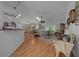 Bright living room with hardwood floors, skylight, and decorative details at 7692 Sw 117Th Street Rd, Ocala, FL 34476