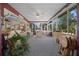 Bright sunroom with ample natural light, comfortable seating, and view of outdoor space at 7692 Sw 117Th Street Rd, Ocala, FL 34476