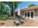 Beautiful backyard deck featuring an outdoor dining area and French door access at 8120 Nw 48Th Ln, Ocala, FL 34482