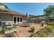 Inviting backyard deck with outdoor dining and seating areas under a pergola at 8120 Nw 48Th Ln, Ocala, FL 34482