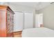 Bright bedroom features dual closets, a dresser, and neutral tones for a relaxing atmosphere at 8120 Nw 48Th Ln, Ocala, FL 34482