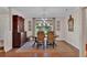 Elegant dining room with wooden table, decorative chairs, and stylish chandelier at 8120 Nw 48Th Ln, Ocala, FL 34482