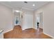 Hallway with lots of closet space, and a view to the exterior, and into a bedroom at 8120 Nw 48Th Ln, Ocala, FL 34482
