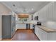 Modern kitchen featuring stainless steel appliances, granite countertops, and ample cabinet space at 8120 Nw 48Th Ln, Ocala, FL 34482