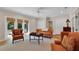 Spacious living area with doors to the outside and comfortable seating at 8120 Nw 48Th Ln, Ocala, FL 34482