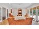 Open living space with a TV, comfortable seating, and outdoor views at 8120 Nw 48Th Ln, Ocala, FL 34482