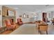 Inviting living room with stone fireplace, comfortable seating, and tile floors at 8120 Nw 48Th Ln, Ocala, FL 34482