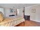 Inviting bedroom showcasing a four-poster bed, ample space, and cozy decor at 8120 Nw 48Th Ln, Ocala, FL 34482