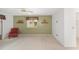 Comfortable carpeted bedroom with a ceiling fan, one chair and window for natural light at 8371 Sw 109Th St, Ocala, FL 34481
