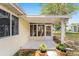 Covered patio is an ideal spot for outdoor seating and potted plants to relax and enjoy the weather at 8371 Sw 109Th St, Ocala, FL 34481