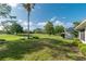 Expansive backyard with manicured lawn and mature trees at 9101 Sw 91St Cir, Ocala, FL 34481