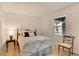 Cozy bedroom featuring a comfortable bed, neutral walls, and plenty of natural light at 9101 Sw 91St Cir, Ocala, FL 34481