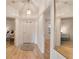 Bright foyer with wood floors, white walls, and a front door with decorative glass at 9101 Sw 91St Cir, Ocala, FL 34481