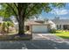 Charming single-story brick home featuring a two-car garage and mature landscaping at 9101 Sw 91St Cir, Ocala, FL 34481