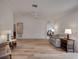 Bright living room with wood floors, neutral decor, and a ceiling fan at 9101 Sw 91St Cir, Ocala, FL 34481