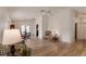Bright living room with wood floors, high ceiling, comfortable seating and lots of natural light at 9101 Sw 91St Cir, Ocala, FL 34481