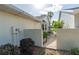 Side yard access through a decorative metal gate and mature landscaping at 9101 Sw 91St Cir, Ocala, FL 34481