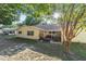 Backyard showcasing the lawn, partially covered patio and landscaping at 9153 Sw 83Rd Ter # E, Ocala, FL 34481