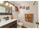 Charming bathroom featuring rustic wooden vanity, decorative towels, and stylish accents at 9153 Sw 83Rd Ter # E, Ocala, FL 34481