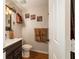 Quaint half bath with decorative fixtures and a vanity that maximizes a small space at 9153 Sw 83Rd Ter # E, Ocala, FL 34481