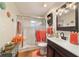 Bathroom with glass shower, neutral tiling, and stylish decor at 9153 Sw 83Rd Ter # E, Ocala, FL 34481